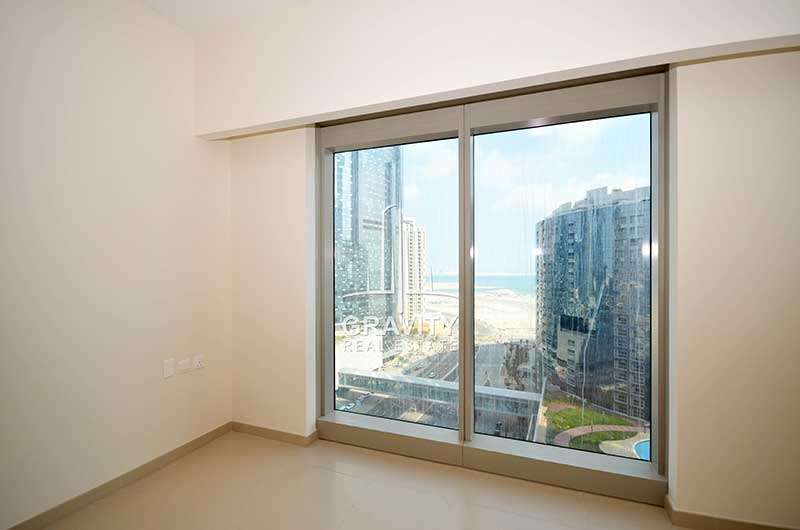 Bedroom-with-a-view-of-Al-reem-community-and-buildings