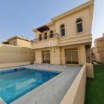 the-back-side-of-a-Cream-colored-4-Bedroom-Villa-Golf-Gardens-with-a-swimming-pool