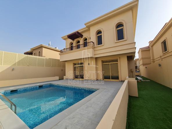 the-back-side-of-a-Cream-colored-4-Bedroom-Villa-Golf-Gardens-with-a-swimming-pool