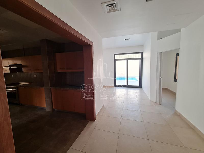 Wide-Entryway-to-the-kitchen-with-windowed-door-opening-in-the-kitchen-in-AL-Raha-Golf-gardens