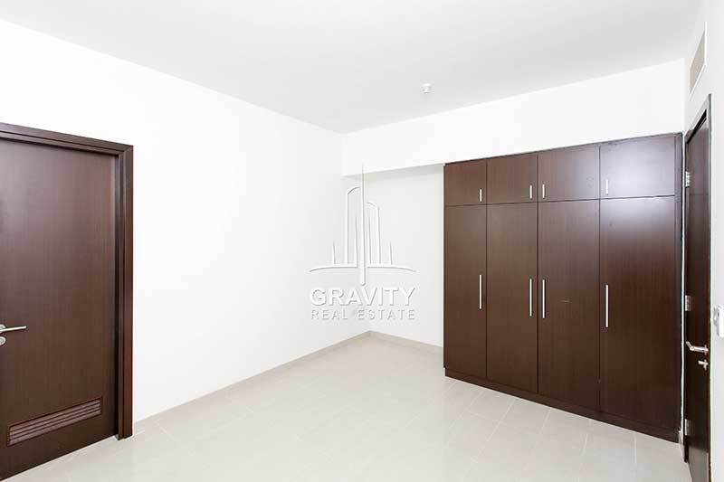 Bedroom-with-built-in-wooden-cabinets-in-Burooj-views-2-bedroom-apartment