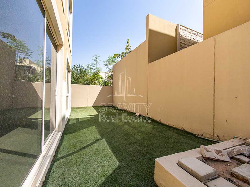 Backyard-in-Al-Raha-Garden-5-bedroom-villa-has-a-lawn