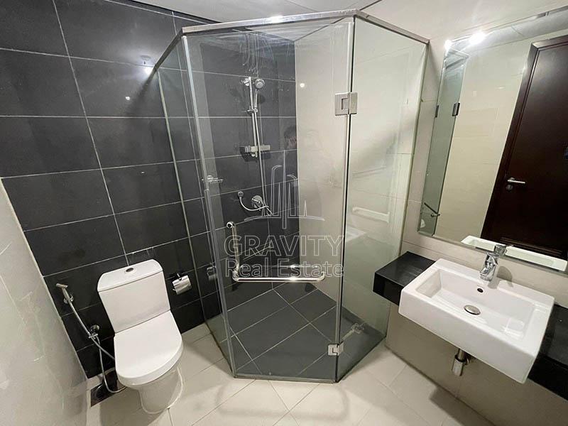 Bathroom-with-a-partition-for-shower-in-apartment-for-sale-Marina-Blue-Towers