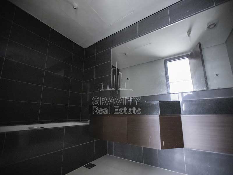 Bathroom-with-black-walled-tiles-in-marina-blue-towers