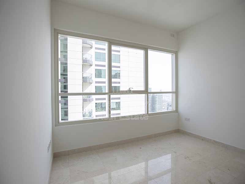 Bedroom-with-a-wide-view-of-a-building-in-marina-heights-tower