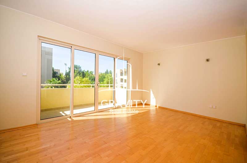 Bedroom-with-wooden-floorings-have-windowed-sliding-doors-opening-to-a-balcony-in-a-4-bedroom-Townhouse-for-sale