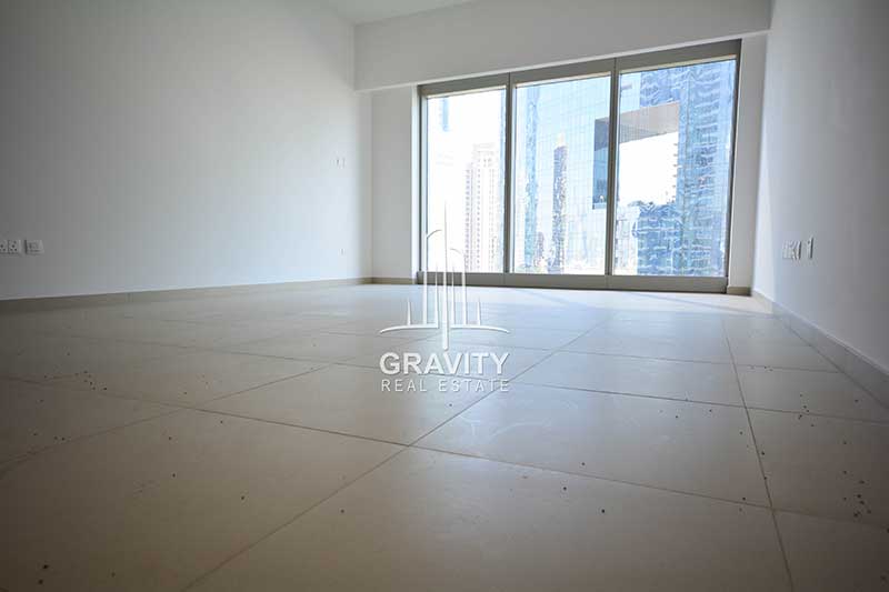 Empty-living-room-with-a-view-of-a-building-in-gate-tower-apartment-for-sale