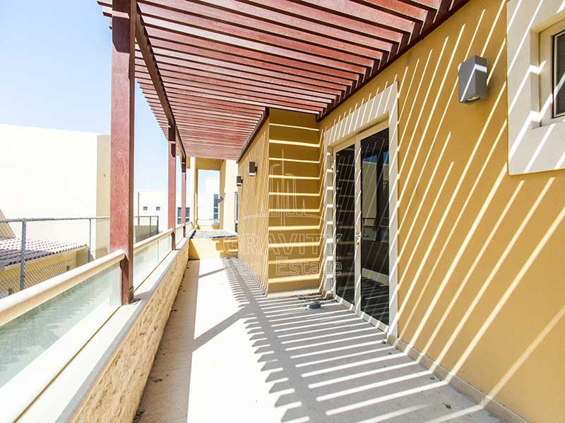 Shaded-outdoor-balcony-in-Al-Raha-Gardens-5-bedroom-villa-for-sale