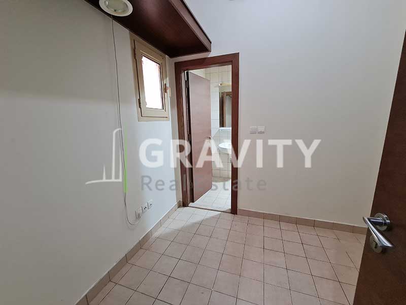 Laundry-room-connecting-to-a-toilet-in-5-Bedroom-villa-in-Al-Raha-Golf-Gardens