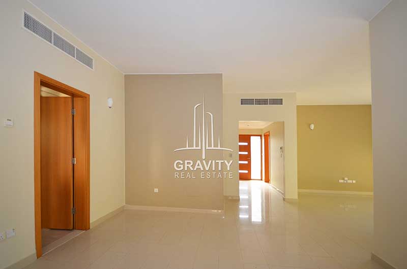 Lavish-living-room-in-Al-Raha-garden-with-the-entrance-to-the-4-bedroom-villa