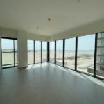 Soho-Square-Saadiyat-property-living-room-with-glazzed-windows-and-coumminty-view.