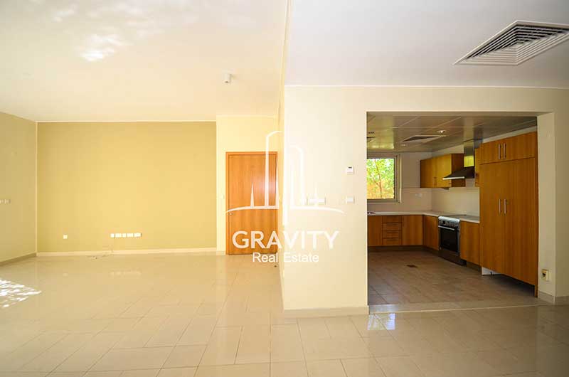 Spacious-Living-room-with-opened-entry-to-the-kitchen-in-a-4-bedroom-Al-Raha-Gardens-Townhouse