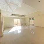 Spacious-living-room-in-Al-Raha-Garden-3-bedroom-Villa-having-white-tiles-cream-colored-walls-with-2-openings-having-windowed-sliding-door