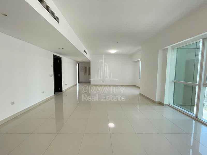 Spacious-living-room-with-a-view-in-2-bedroom-apartment-mag-5-marina-reem-island