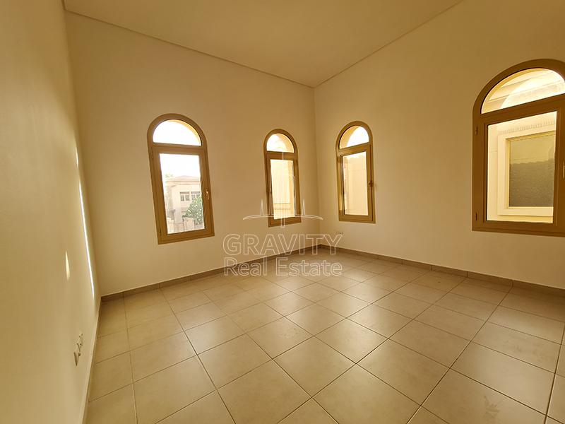 Square-shaped-bedroom-in-Al-Raha-Golf-gardens-that-have-tiled-floorings-and-4-windows