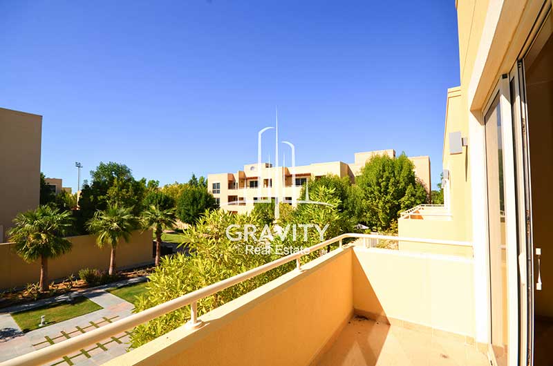 The-view-of-the-balcony-from-Al-Raha-Gardens-Townhouse-that-has-the-surrounding-properties-and-trees