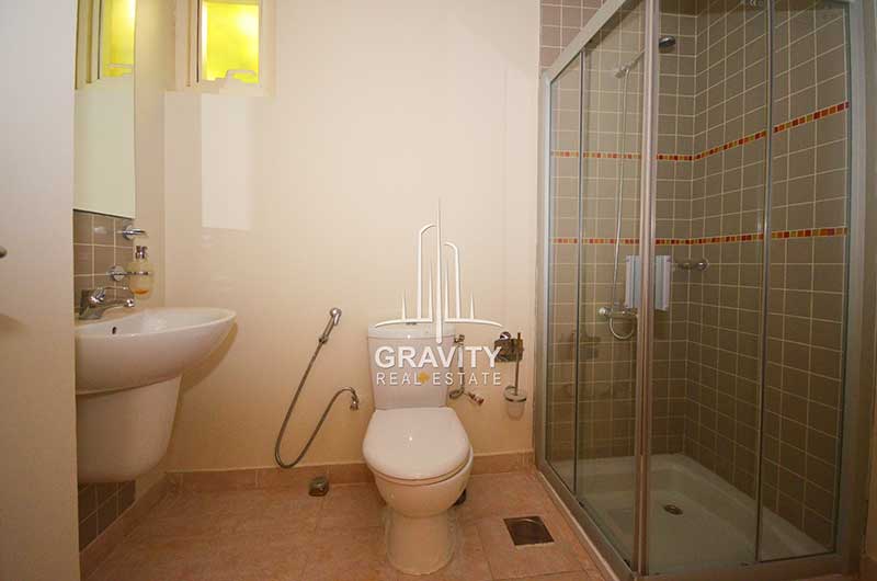 Toilet-with-an-enclosed-cubicle-for-shower-in-Al-Raha-Gardens-4-bedroom-villa-for-sale