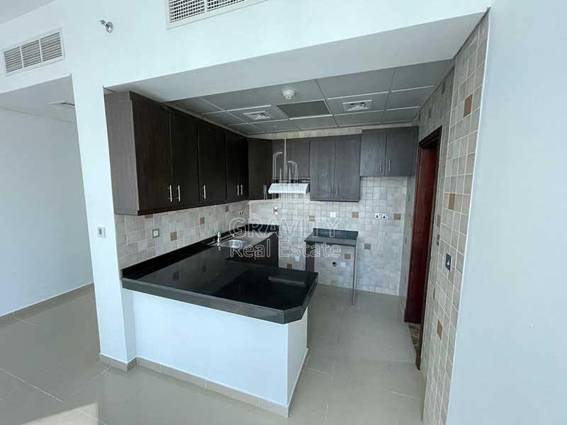 spacious-open-kitchen-with-numerous-cabinets-in-studio-apartment-in-hydra-avenue-c5