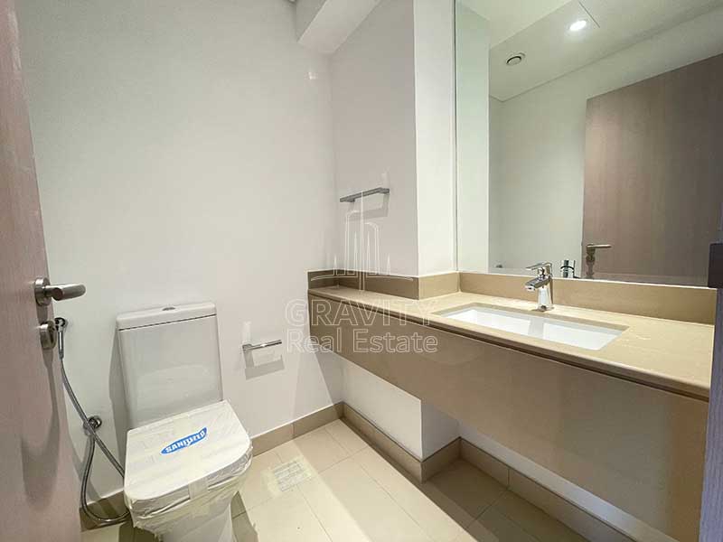 bathroom-with-sink-and-mirror-in-3-bedroom-apartment-in-yas-island