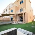 reef-villas-abudhabi-propety-garden-with-sun-shade-and-glass-door