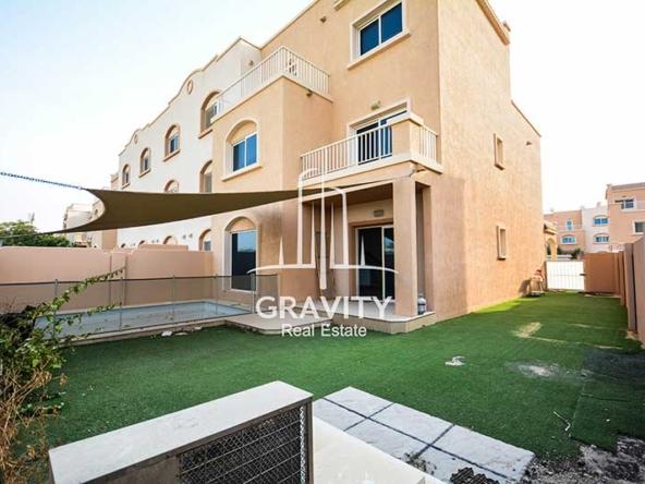 reef-villas-abudhabi-propety-garden-with-sun-shade-and-glass-door