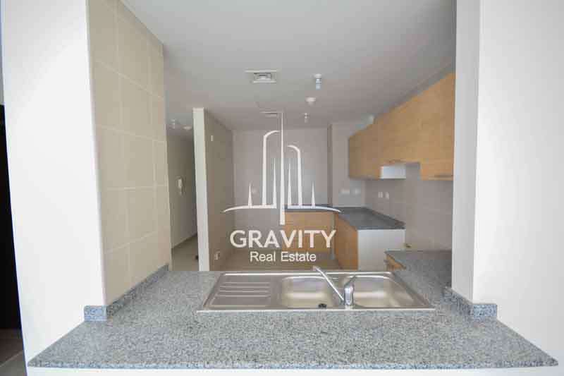 Open-kitchen-with-a-sink-at-the-partition-in-a-2-bedroom-apartment-in-sigma-tower-2