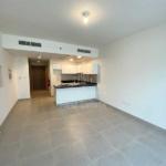 soho-square-saadiyat-studio-apartment-open-kitchen-and-living-room-studio-door-entrance-and-central-ac