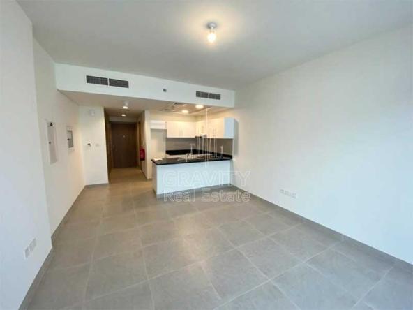 soho-square-saadiyat-studio-apartment-open-kitchen-and-living-room-studio-door-entrance-and-central-ac