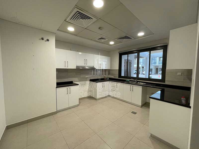 large-kitchen-with-white-cabinets-in-5-bedroom-townhouse