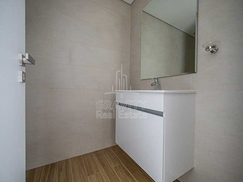 powder-room-with-mirror-and-sink-in-al-raha-beach-al-raha-lofts