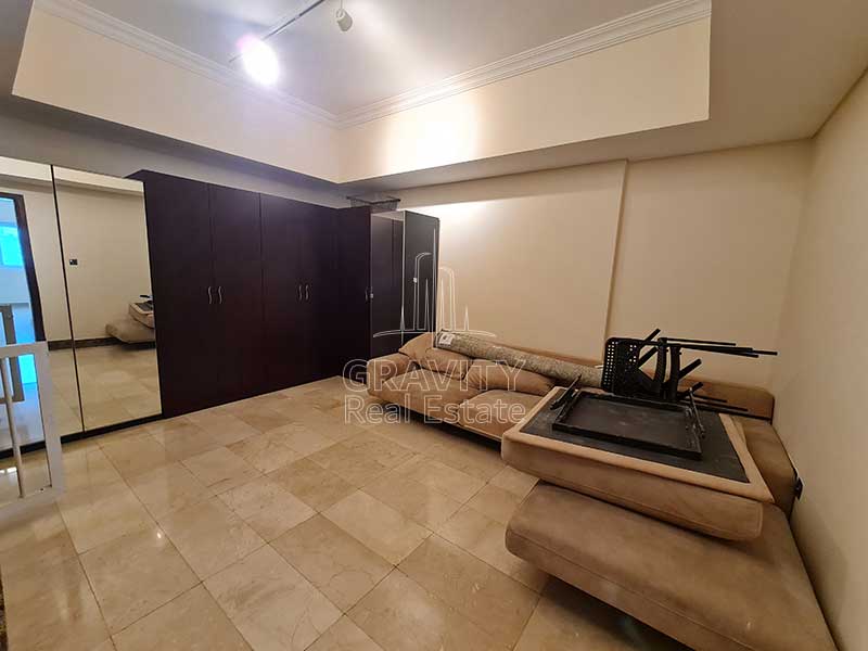 upper-floor-with-cream-colored-ceramic-tiles-sofa-set-and-huge-brown-wardrobe-in-2-bedroom-townhouse-in-hydra-avenue-c6