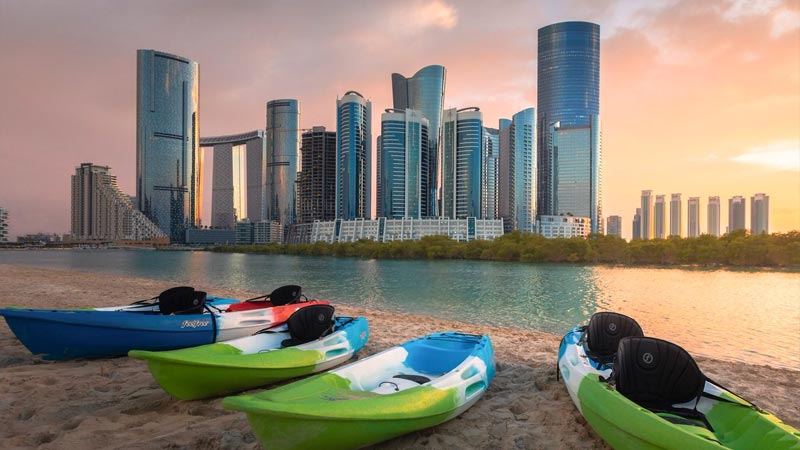 city-of-lights-skyline-as-seen-from-the-beach-during-sunset-with-gate-tower-in-background