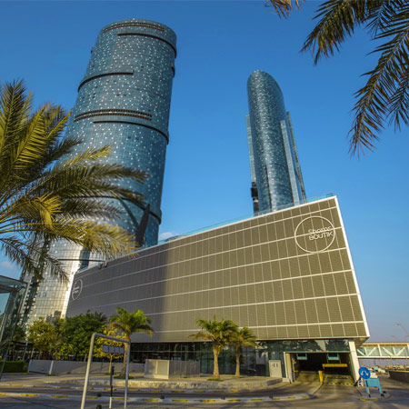 shams-boutik-mall-with-sky-and-sun-tower-behind-it