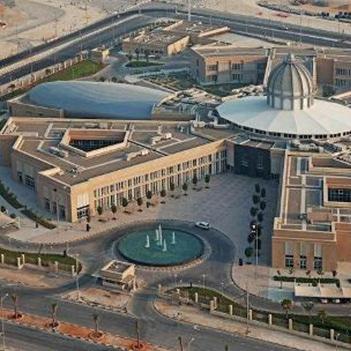 aerial-view-of-sorbonne-university-abu-dhabi-with-dome-at-its-centre-and-water-fountain-at-its-entrance