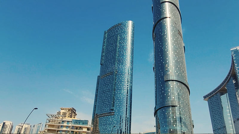 bottom-up-view-of-sun-tower-and-sky-tower