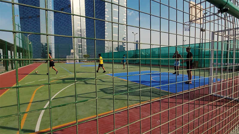 miniature-football-field-on-sky-and-sun-tower-podium