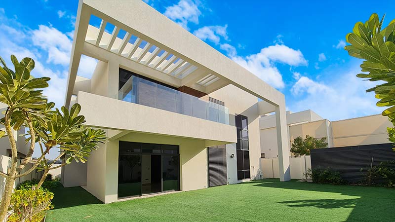 west-yas-villa-bottom-up-view-from-backyard-with-blue-and-cloudy-sky