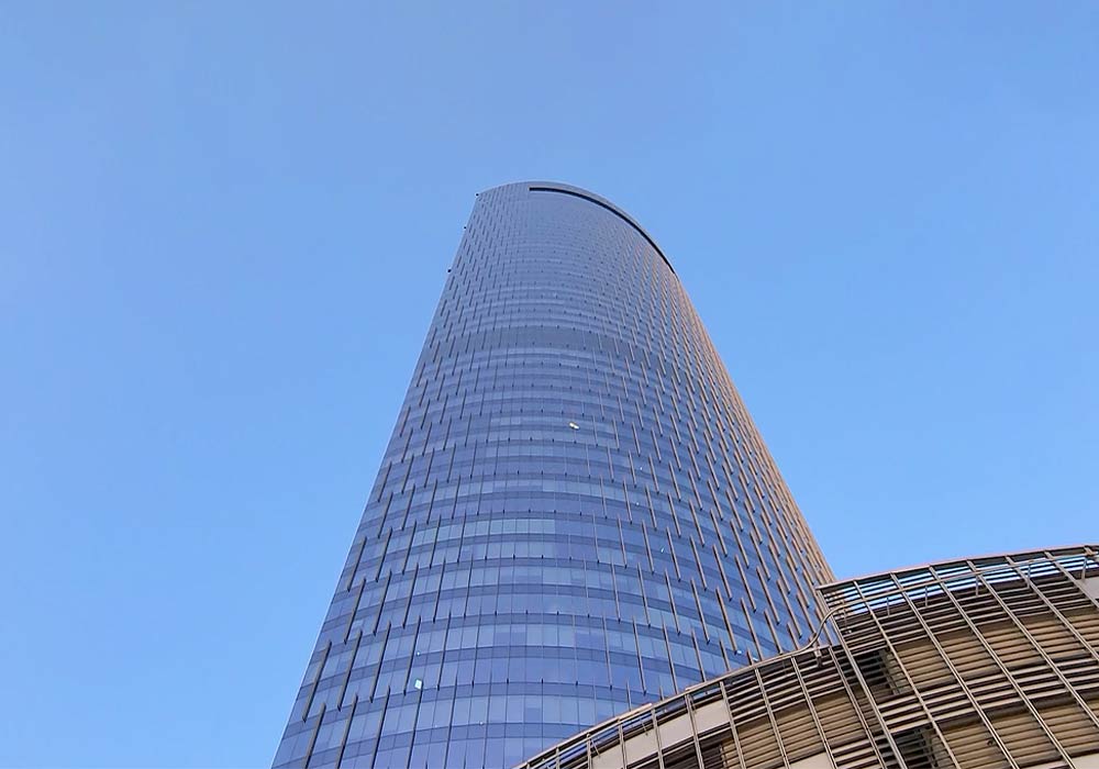 addax-office-tower-bottom-up-view-of-its-front-side-with-focus-on-its-top-floor