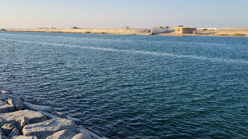 body-of-water-off-the-shore-of-yas-island-with-rocks-next-to-the-water