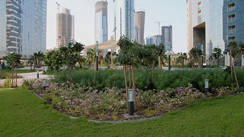 grasses-flowerbed-and-young-trees-on-gate-tower-3-and-arc-towers-podium-top-garden