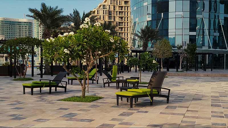 sun-lounges-on-sky-tower-and-sun-tower-podium-surrounded-by-jasmine-trees