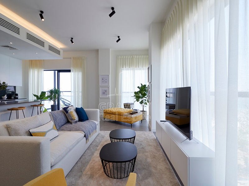 A-cozy-living-room-with-modern-decor-The-walls-are-painted-in-a-light-grey-color-pixels-abu-Dhabi