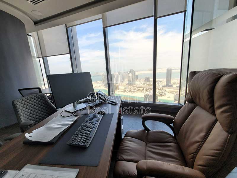 Cozy-office-room-with-comfotable-office-chair-plus-window-overlooking-the-beautiful-sky-scrapers-from-addax-office-tower