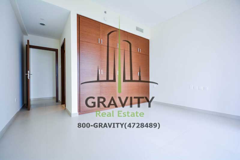 Spacious-master-bedroom-with-big-built-in-brown-wardrobe-in-a-2-bedroom-apartment-in-arc-tower-reem-