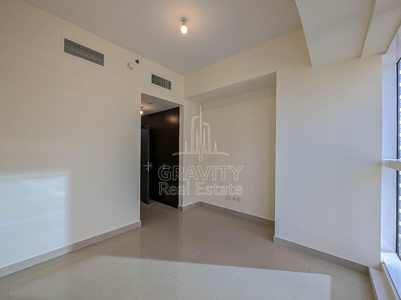 bedroom-with-big-galss-window-in-a-3-bedroom-apartment- in-marina-bay-reem-island