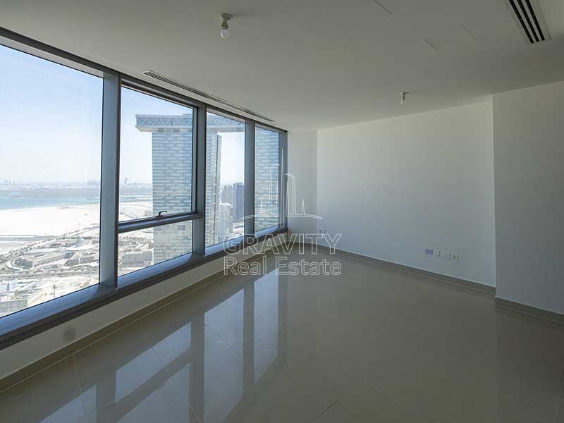 living-room--with-huge-glass-windows-and-white-walls-in-stunning-1-bedroom-apartment-in-sky-tower-reem-island