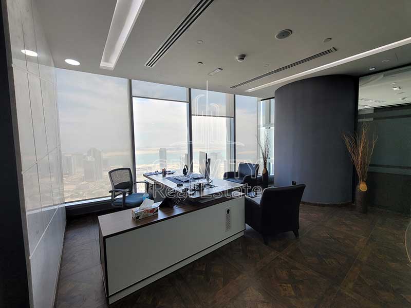 nice-office-room-with-L-shape-office-table-and-chairs-surrounding-the-table-with-nice-decors-addax-office-tower