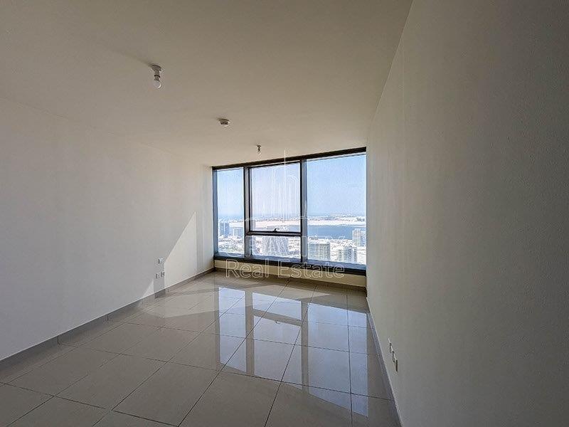 peaceful-looking-living-room-with-window-panel-in-sun-towers