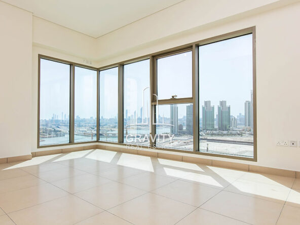 spacious-living-room-with-huge-windows-and-marble-tiles-in-wave-tower-reem-island-apartment