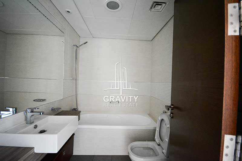 well-maintained-bathroom-with-bath-tub-sink-huge-mirror-and-in-a-1-br-apt-in-the-arc-tower